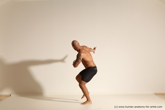 Underwear Gymnastic poses Man Black Muscular Bald Dancing Dynamic poses Academic