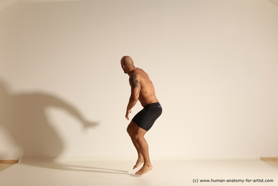 Underwear Gymnastic poses Man Black Muscular Bald Dancing Dynamic poses Academic