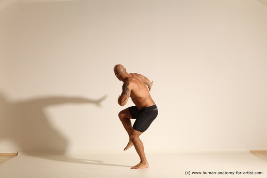 Underwear Gymnastic poses Man Black Muscular Bald Dancing Dynamic poses Academic