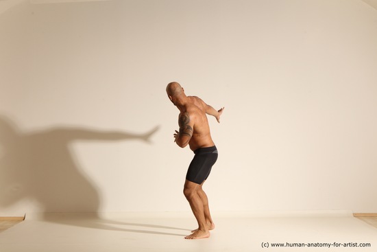 Underwear Gymnastic poses Man Black Muscular Bald Dancing Dynamic poses Academic