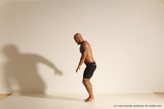 Underwear Gymnastic poses Man Black Muscular Bald Dancing Dynamic poses Academic