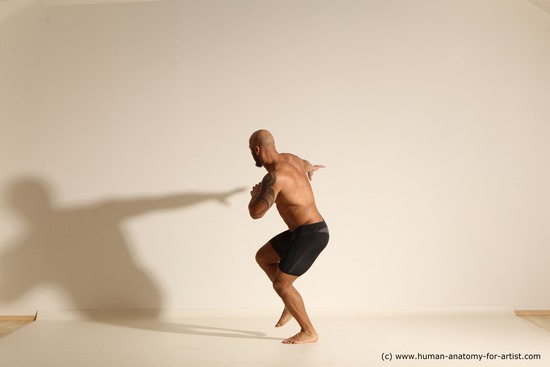 Underwear Gymnastic poses Man Black Muscular Bald Dancing Dynamic poses Academic