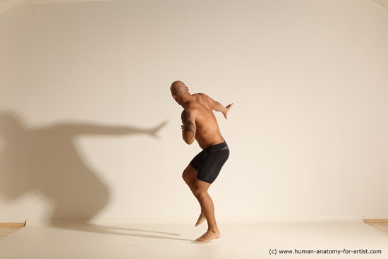 Underwear Gymnastic poses Man Black Muscular Bald Dancing Dynamic poses Academic