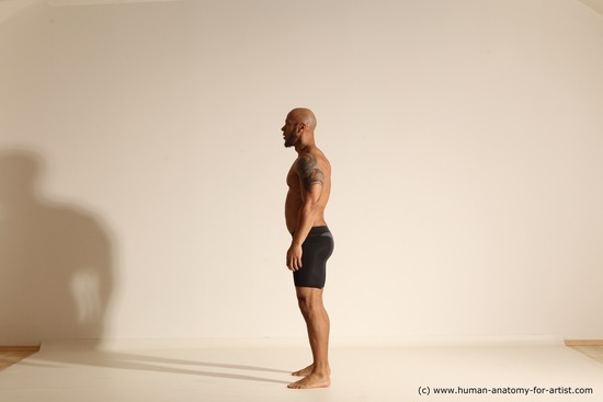 Underwear Gymnastic poses Man Black Muscular Bald Dancing Dynamic poses Academic