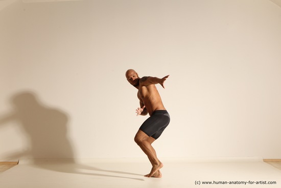 Underwear Gymnastic poses Man Black Muscular Bald Dancing Dynamic poses Academic