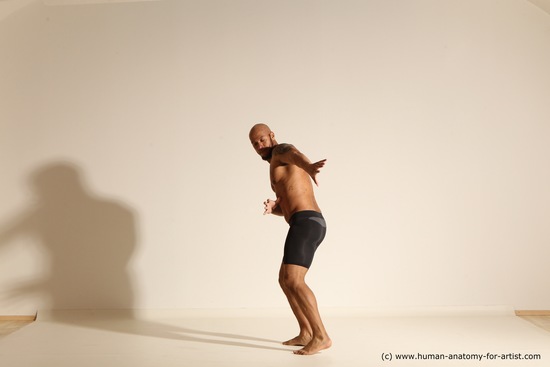 Underwear Gymnastic poses Man Black Muscular Bald Dancing Dynamic poses Academic