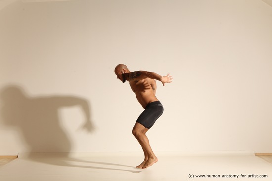 Underwear Gymnastic poses Man Black Muscular Bald Dancing Dynamic poses Academic