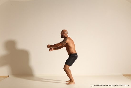 Underwear Gymnastic poses Man Black Muscular Bald Dancing Dynamic poses Academic