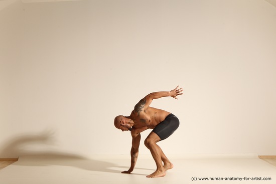 Underwear Gymnastic poses Man Black Muscular Bald Dancing Dynamic poses Academic