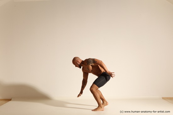 Underwear Gymnastic poses Man Black Muscular Bald Dancing Dynamic poses Academic