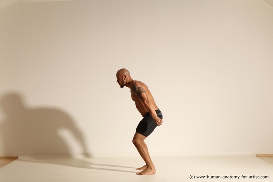 Underwear Gymnastic poses Man Black Muscular Bald Dancing Dynamic poses Academic