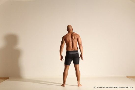 Underwear Gymnastic poses Man Black Muscular Bald Dancing Dynamic poses Academic