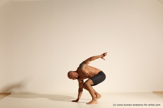 Underwear Gymnastic poses Man Black Muscular Bald Dancing Dynamic poses Academic