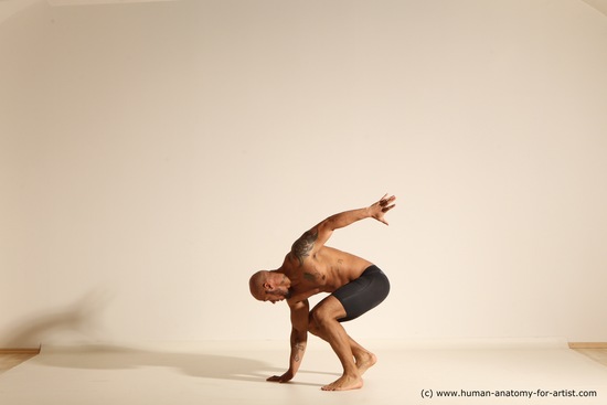 Underwear Gymnastic poses Man Black Muscular Bald Dancing Dynamic poses Academic