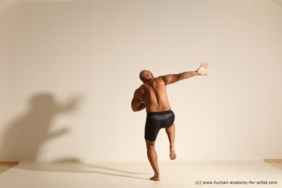 Underwear Gymnastic poses Man Black Muscular Bald Dancing Dynamic poses Academic