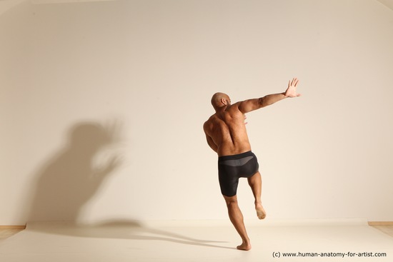 Underwear Gymnastic poses Man Black Muscular Bald Dancing Dynamic poses Academic