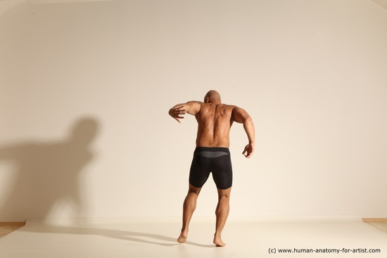 Underwear Gymnastic poses Man Black Muscular Bald Dancing Dynamic poses Academic