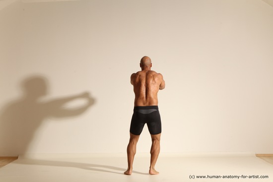 Underwear Gymnastic poses Man Black Muscular Bald Dancing Dynamic poses Academic