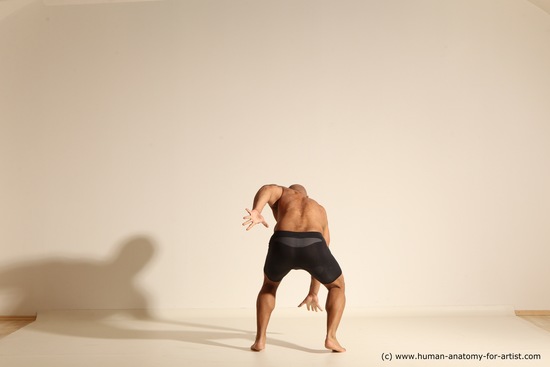 Underwear Gymnastic poses Man Black Muscular Bald Dancing Dynamic poses Academic