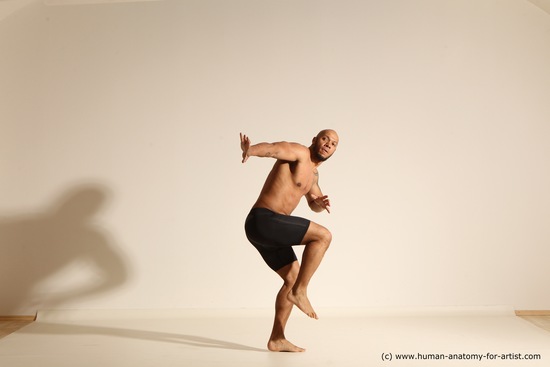 Underwear Gymnastic poses Man Black Muscular Bald Dancing Dynamic poses Academic