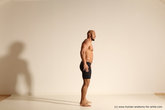 Underwear Gymnastic poses Man Black Muscular Bald Dancing Dynamic poses Academic