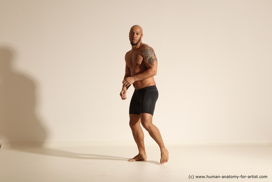 Underwear Gymnastic poses Man Black Muscular Bald Dancing Dynamic poses Academic