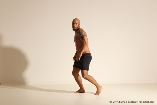 Underwear Gymnastic poses Man Black Muscular Bald Dancing Dynamic poses Academic