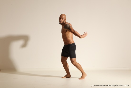 Underwear Gymnastic poses Man Black Muscular Bald Dancing Dynamic poses Academic