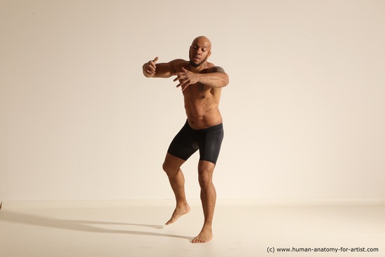 Underwear Gymnastic poses Man Black Muscular Bald Dancing Dynamic poses Academic