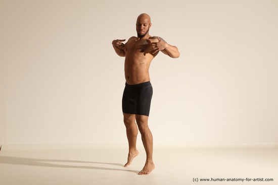 Underwear Gymnastic poses Man Black Muscular Bald Dancing Dynamic poses Academic