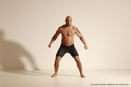 Underwear Gymnastic poses Man Black Muscular Bald Dancing Dynamic poses Academic