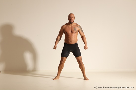 Underwear Gymnastic poses Man Black Muscular Bald Dancing Dynamic poses Academic