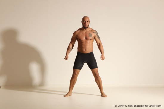 Underwear Gymnastic poses Man Black Muscular Bald Dancing Dynamic poses Academic