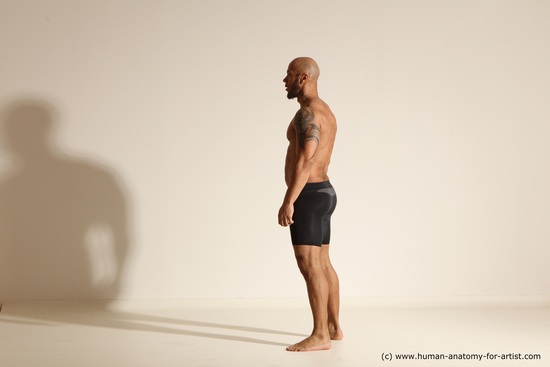 Underwear Gymnastic poses Man Black Muscular Bald Dancing Dynamic poses Academic