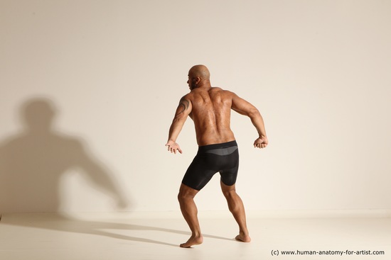 Underwear Gymnastic poses Man Black Muscular Bald Dancing Dynamic poses Academic