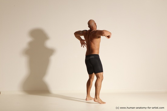 Underwear Gymnastic poses Man Black Muscular Bald Dancing Dynamic poses Academic