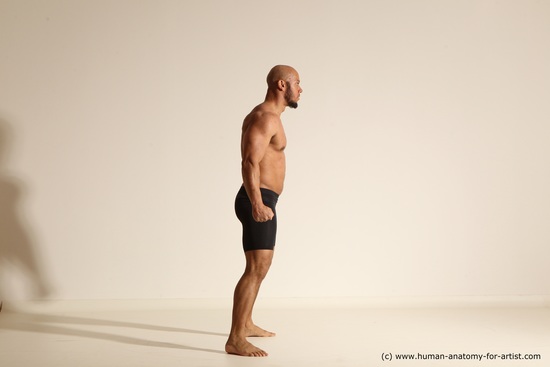 Underwear Gymnastic poses Man Black Muscular Bald Dancing Dynamic poses Academic