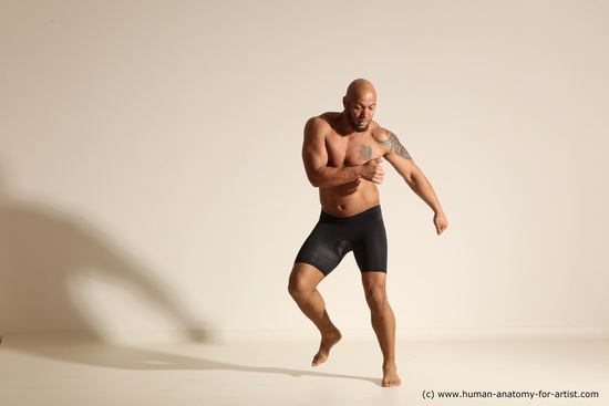 Underwear Gymnastic poses Man Black Muscular Bald Dancing Dynamic poses Academic