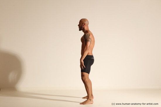 Underwear Gymnastic poses Man Black Muscular Bald Dancing Dynamic poses Academic