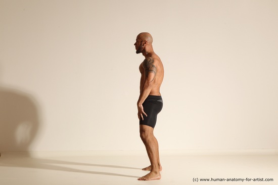 Underwear Gymnastic poses Man Black Muscular Bald Dancing Dynamic poses Academic