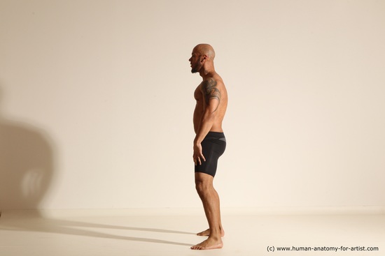 Underwear Gymnastic poses Man Black Muscular Bald Dancing Dynamic poses Academic