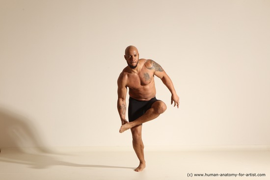 Underwear Gymnastic poses Man Black Muscular Bald Dancing Dynamic poses Academic