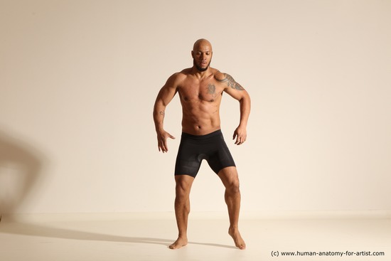 Underwear Gymnastic poses Man Black Muscular Bald Dancing Dynamic poses Academic