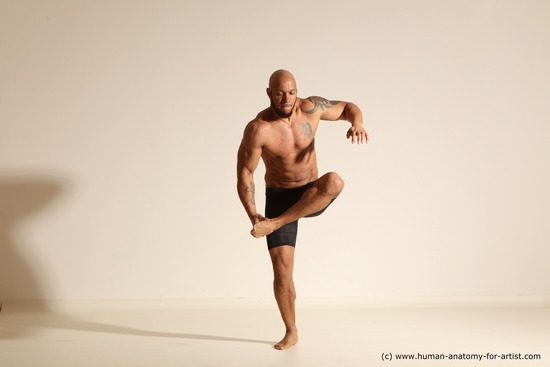 Underwear Gymnastic poses Man Black Muscular Bald Dancing Dynamic poses Academic