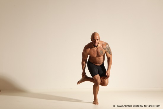 Underwear Gymnastic poses Man Black Muscular Bald Dancing Dynamic poses Academic