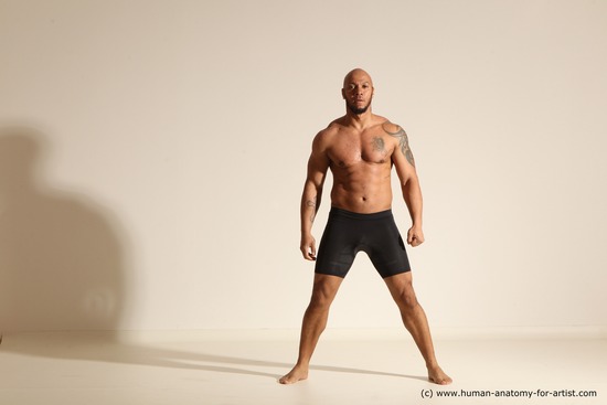 Underwear Gymnastic poses Man Black Muscular Bald Dancing Dynamic poses Academic