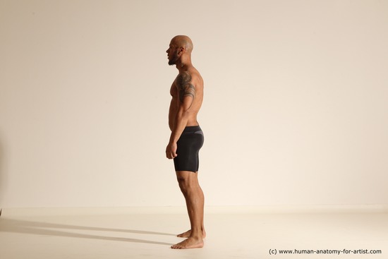 Underwear Gymnastic poses Man Black Muscular Bald Dancing Dynamic poses Academic