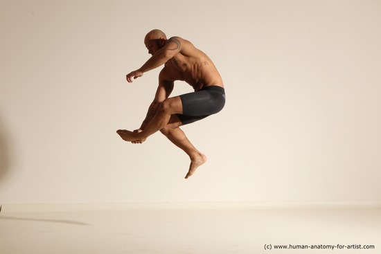 Underwear Gymnastic poses Man Black Muscular Bald Dancing Dynamic poses Academic