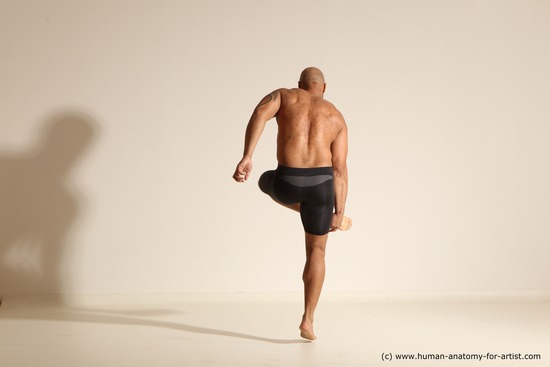 Underwear Gymnastic poses Man Black Muscular Bald Dancing Dynamic poses Academic