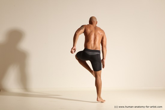 Underwear Gymnastic poses Man Black Muscular Bald Dancing Dynamic poses Academic